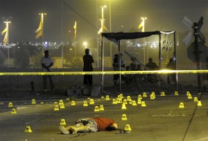 A man lies dead among evidence markers at a crime scene in the border city of Ciudad Juarez ciudad_juarez
